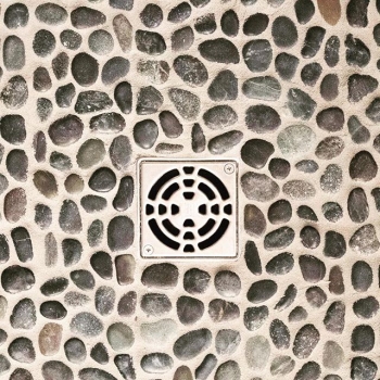 Custom tile showers are the best. One of our favourite finishes for the base are pebbles! They look beautiful, feel amazing and create a spa-like feel that is the perfect way to start or end your day! #crawfordhomesfortyyearsstrong #interiordesign #yqrh
